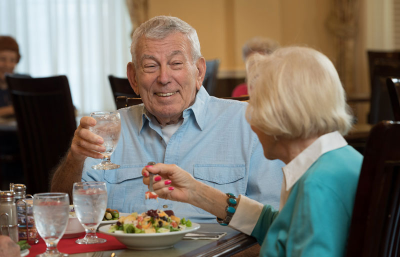 A couple is dining at the table